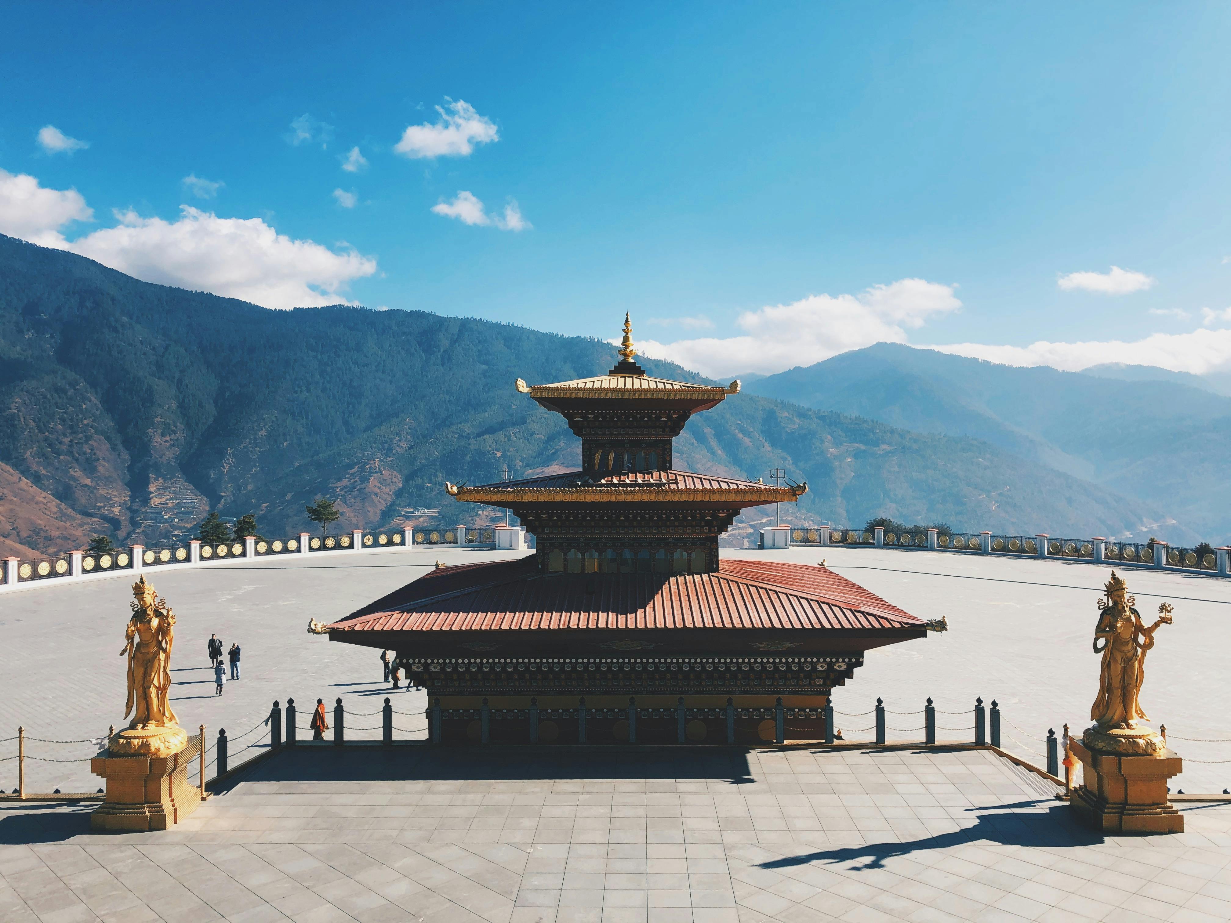 Mountain dzong fortress above forested valleys